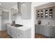 Modern kitchen with gray cabinets, white quartz countertops, and stainless steel appliances at 8820 Melvin St # 16, Willow Springs, NC 27592