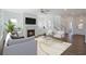 Spacious living room with fireplace, hardwood floors and large windows at 8820 Melvin St # 16, Willow Springs, NC 27592
