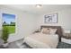 Cozy bedroom with a double bed and a large window with scenic views at 8820 Melvin St # 16, Willow Springs, NC 27592