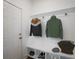 Convenient mudroom with bench seating, coat hooks, and shoe storage at 8820 Melvin St # 16, Willow Springs, NC 27592