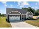 Beautiful single-story house with a landscaped front yard and double garage at 87 S Cousins Ct, Smithfield, NC 27577