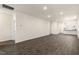 Open living room with vinyl plank flooring and views into the kitchen at 795 Washington St, Fuquay Varina, NC 27526