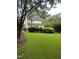 Spacious backyard with lush green grass and a storage shed at 2638 Davis St, Raleigh, NC 27608