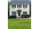 Two-story house with vinyl siding, a covered entry, and a well-maintained lawn at 2638 Davis St, Raleigh, NC 27608