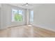 Well-lit bedroom featuring hardwood floors and multiple windows at 779 Willard St, Durham, NC 27701