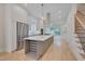 Open concept kitchen with island, stainless steel appliances, and hardwood floors at 779 Willard St, Durham, NC 27701