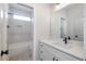 Modern bathroom with white vanity, quartz countertop, and subway tile shower at Lot 4 Harding St, Efland, NC 27243