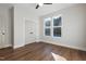 Spacious bedroom featuring hardwood floors, double doors, and ample natural light at Lot 4 Harding St, Efland, NC 27243