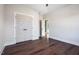 Bedroom with hardwood floors, double doors to closet, and access to other rooms at Lot 4 Harding St, Efland, NC 27243