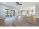 Open concept living room and kitchen with hardwood floors and access to deck at Lot 4 Harding St, Efland, NC 27243