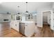 Modern kitchen featuring a large island, stainless steel appliances, and ample cabinet space at Lot 4 Harding St, Efland, NC 27243