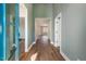 Bright and airy entryway with hardwood floors and soft green walls at Lot 4 Harding St, Efland, NC 27243