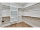 Large walk-in closet with shelves and hanging rods for storage at Lot 4 Harding St, Efland, NC 27243
