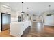 Open concept kitchen with island and stainless steel appliances at Lot 4 Harding St, Efland, NC 27243
