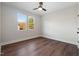 Well-lit bedroom with hardwood floors and two large windows offering scenic views at Lot 4 Harding St, Efland, NC 27243