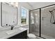 Bathroom with walk-in shower, modern vanity, and window at 55 Harvest View Way, Franklinton, NC 27525