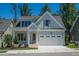 Two-story home with light blue siding and white trim at 1687 Terry Rd, Durham, NC 27712