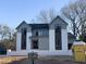 Modern two-story home with gray siding and a stylish design at 5208 Knollwood Rd, Raleigh, NC 27609