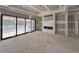 Unfinished room with fireplace and sliding glass doors at 5208 Knollwood Rd, Raleigh, NC 27609