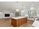 Open kitchen with stainless steel sink and island at 60 Harvest View Way, Franklinton, NC 27525