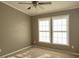 Well-lit bedroom with neutral walls and carpet flooring at 196 Collin Dr, Roxboro, NC 27574