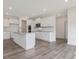 Modern kitchen with white cabinets, granite countertops and island at 117 Shelby Meadow Ln, Angier, NC 27501