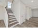 Modern staircase with wood accents and light walls at 117 Shelby Meadow Ln, Angier, NC 27501