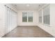 Sun-filled room with large windows and wood-look flooring at 180 Harpeth Dr, Franklinton, NC 27525