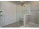 Walk-in shower with white subway tile, glass enclosure, and built-in bench at 6048 Scalybark Rd, Durham, NC 27712