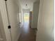 Bright entryway with wood-look flooring and access to backyard at 132 Ewing Dr, Selma, NC 27576