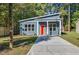 Modern blue house with orange door and driveway at 812 East St, Smithfield, NC 27577