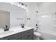 Modern bathroom with double vanity, large mirror, and a shower/tub combo at 812 East St, Smithfield, NC 27577