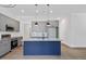 Modern kitchen with gray cabinets and a blue island at 812 East St, Smithfield, NC 27577