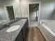 Bathroom with granite double vanity, soaking tub, and separate shower at 46 Scotties Ridge Dr, Princeton, NC 27569