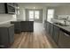 Modern kitchen with gray cabinets and granite countertops at 46 Scotties Ridge Dr, Princeton, NC 27569
