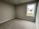 Simple bedroom with carpeted floor and a window at 46 Scotties Ridge Dr, Princeton, NC 27569