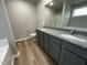 Double vanity bathroom with granite countertop and vinyl flooring at 46 Scotties Ridge Dr, Princeton, NC 27569