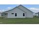 Exterior view of house showcasing vinyl siding and a covered patio at 46 Scotties Ridge Dr, Princeton, NC 27569