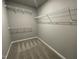 Walk-in closet with wire shelving and carpet flooring at 46 Scotties Ridge Dr, Princeton, NC 27569