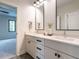 Double vanity bathroom with modern fixtures and a view of the bedroom at 2104 Manuel St, Raleigh, NC 27612