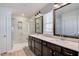 Bathroom with double vanity, large mirror and shower at 2756 Lacy Holt Rd, Graham, NC 27253