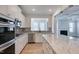 Modern kitchen with white cabinets, granite countertops, and island at 2756 Lacy Holt Rd, Graham, NC 27253