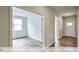 View down a hallway showcasing an open floor plan and access to other rooms at 1677 Abberly Pl, Graham, NC 27253