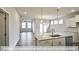Modern kitchen with island, granite counters, and stainless steel appliances at 1677 Abberly Pl, Graham, NC 27253