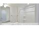 Bathroom with granite countertop, shower/tub combo, and modern fixtures at 1677 Abberly Pl, Graham, NC 27253