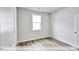 Spacious bedroom with wood-look floors and a large window at 1677 Abberly Pl, Graham, NC 27253