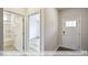 Bright entry hall with wood-look floors, leading to bathroom and additional rooms at 1677 Abberly Pl, Graham, NC 27253