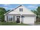 Two-story house with gray siding and white trim at 1677 Abberly Pl, Graham, NC 27253