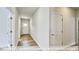 Open hallway with wood-look floors and access to other rooms at 1677 Abberly Pl, Graham, NC 27253