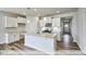 Modern kitchen with white cabinets and granite island at 1677 Abberly Pl, Graham, NC 27253